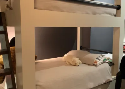 A person sitting on a bunk bed.