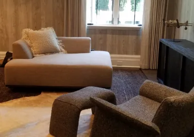 A living room with a cowhide rug and a couch.