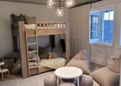 A living room with a bunk bed and a coffee table.
