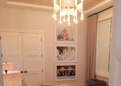 A living room with wood ceilings and a chandelier.