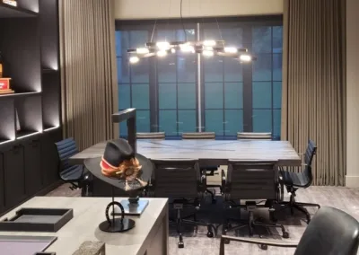 A modern office with a desk and chairs.